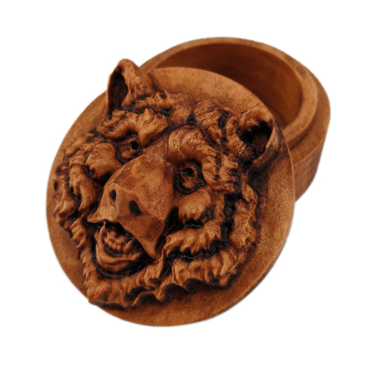 Round wooden box 3D carved with a bears head looking straight ahead. It has burly fur and deep pocketed eyes with its mouth slightly opened revealing its teeth. Made from hard maple wood with a brown stain against a white background.