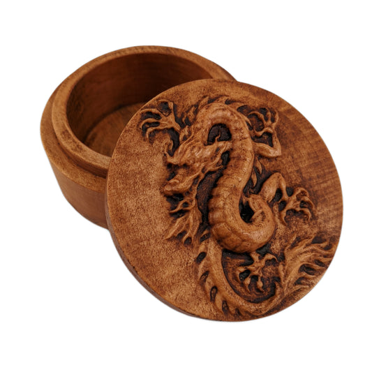 Round wooden box 3D carved with a Chinese dragon coiled around into an upright position. It has an angry bearded face, scaled underbelly, sharp claws, and spines down its back. Made from hard maple wood with a brown stain against a white background.
