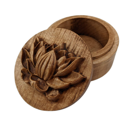Round wooden box 3D carved with a side profile of a lotus flower. It has several layers of leaves closer to the bottom and layers of petals going up the flower to the pointed center. Made from hard maple wood stained brown against a white background.
