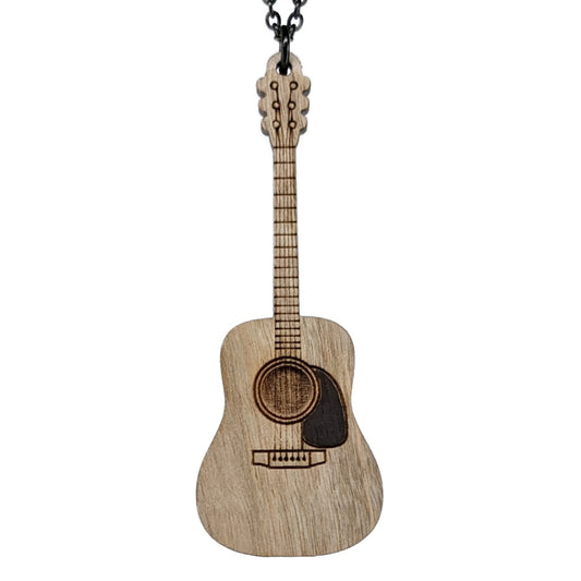 Wooden necklace pendant created in the shape of a miniature acoustic guitar . Made from maple wood and hanging from a black stainless steel chain against a white background.