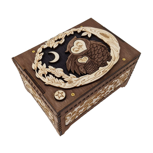Mother and baby owl music box, dark brown, black and birch wood in color, with a sweet moon and star themed design.