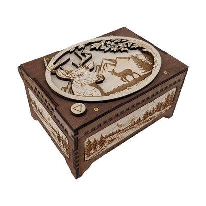Wooden music box with laser-cut deer design on a white background