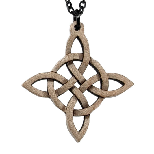 Wooden necklace pendant created in the style of a Celtic woven cross. Made from maple wood.  Hanging from a black stainless steel chain against a white background.