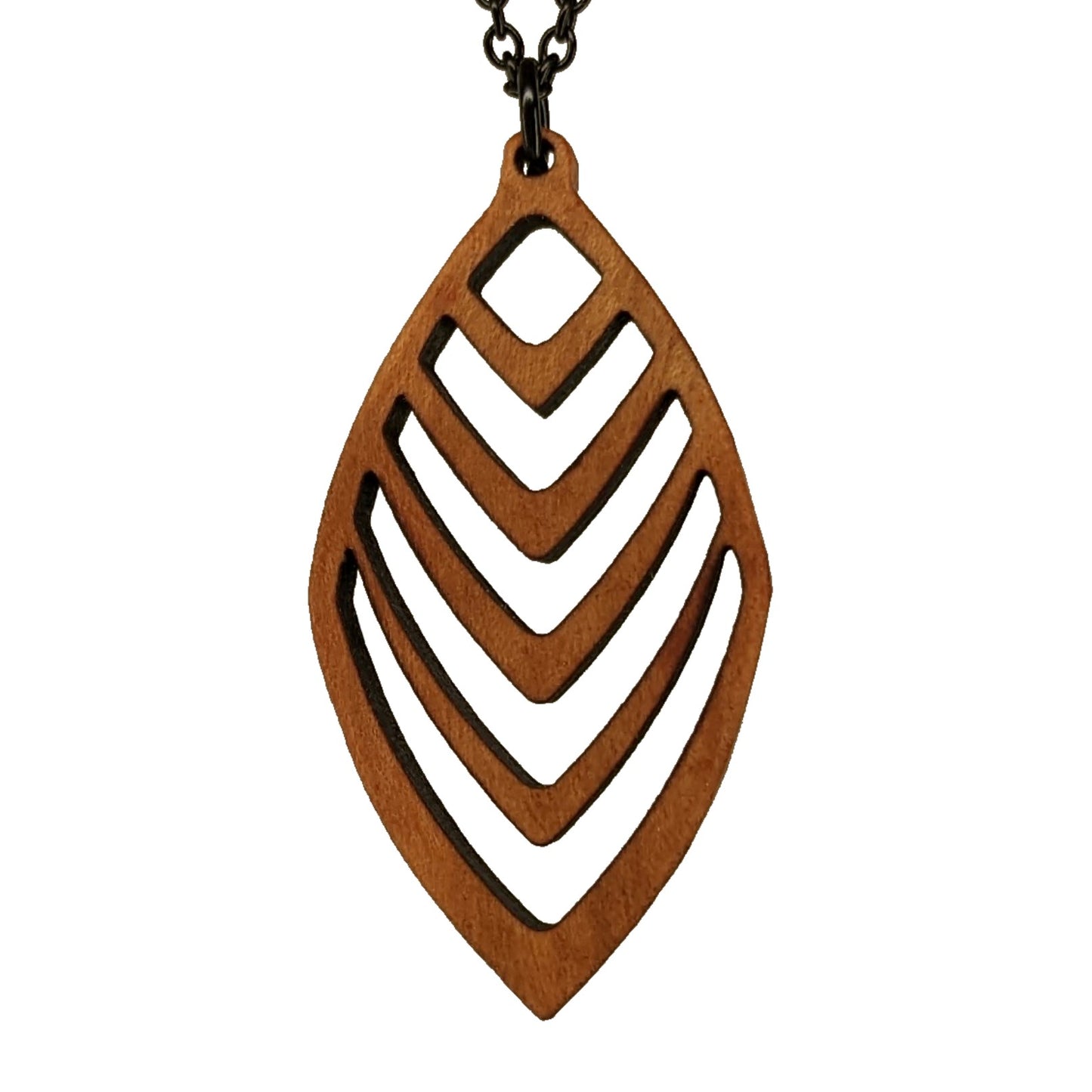 Wooden necklace pendant cut into a teardrop shape with a chevron pattern cut throughout it. Made from hard maple and hanging from a black stainless steel chain against a white background.