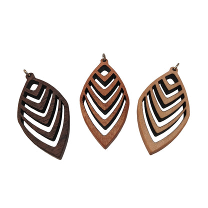 3 wooden necklace pendants cut into a teardrop shape with a chevron pattern cut throughout them. Made from dark walnut, cherry and hard maple. Lying on a white background.