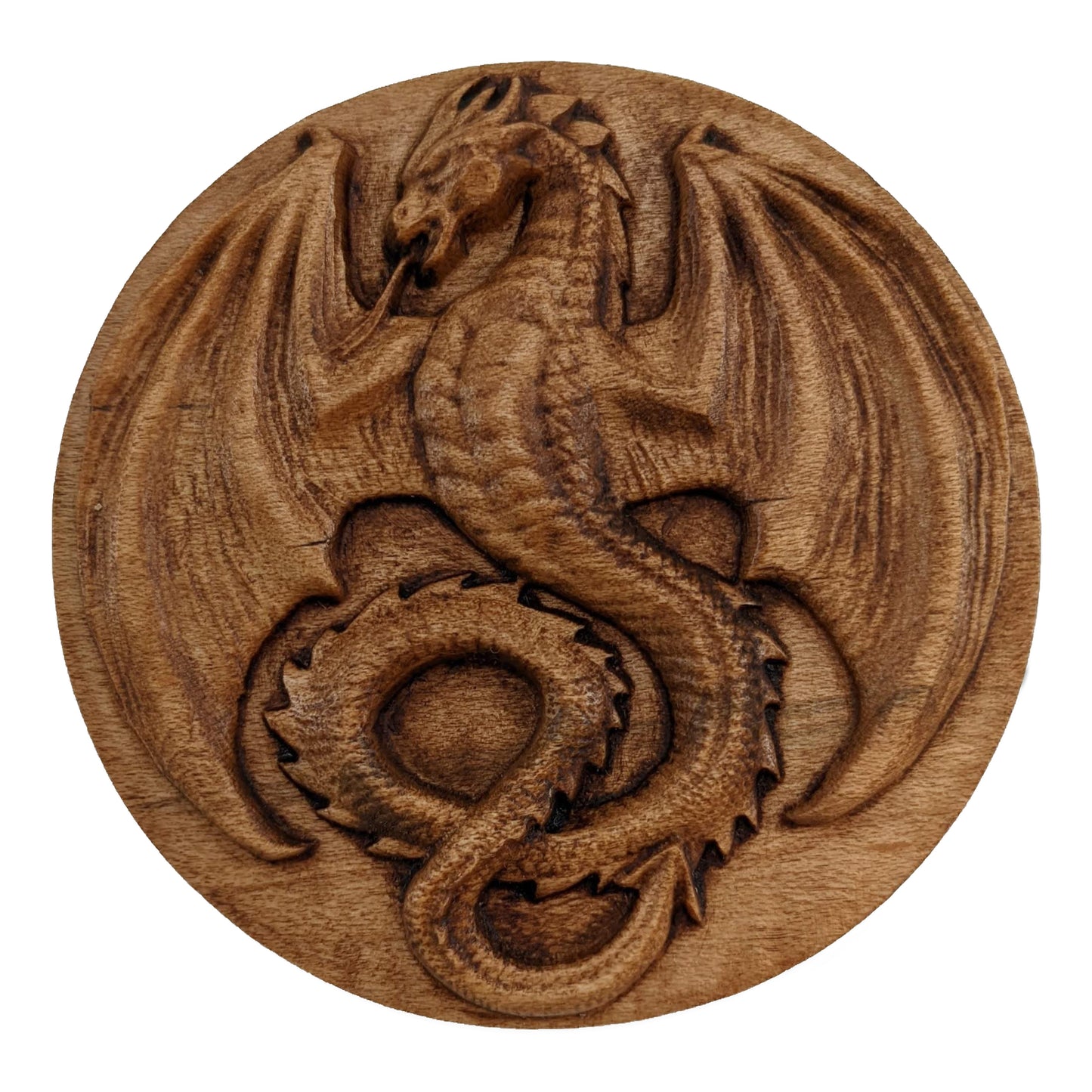 Round wooden box 3D carved with a mediaeval dragon with pointed wings spread, horned head, open mouth and serpentine tongue. It has scales down its belly and spines all down its back. Made from hard maple wood stained brown against a white background