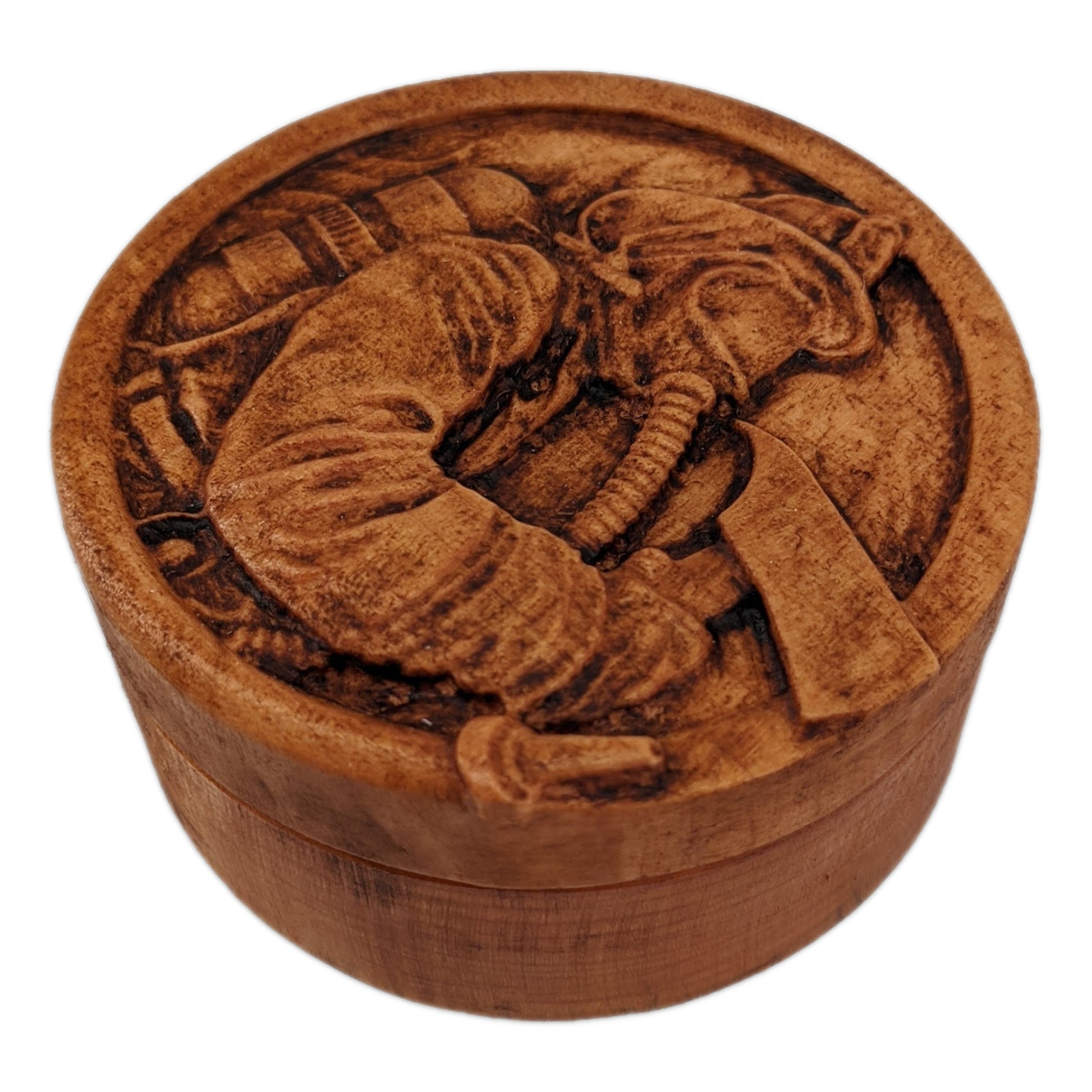 Round wooden box 3D carved with a firefighter in full gear with hat, oxygen tank, mask on and axe in hand within a fire hose border in front of a background of flames. Made from hard maple wood with a brown stain against a white background