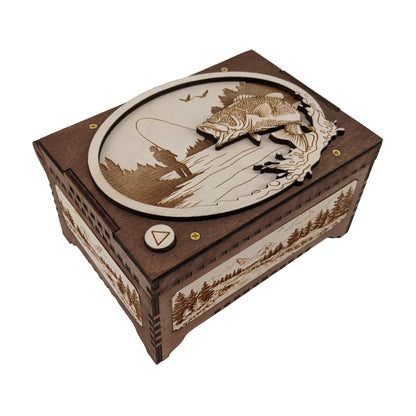 Fisherman themed music box with a peaceful river fishing scene engraved on the top of the music box. A light wood border showcases a detailed fish leaping out of the water against a dark wood background.