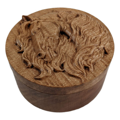 Round wooden box 3D carved with a horse face and neck looking to the left. The horse has long hair flowing from behind its face and down its neck. Made from hard maple wood stained brown against a white background.