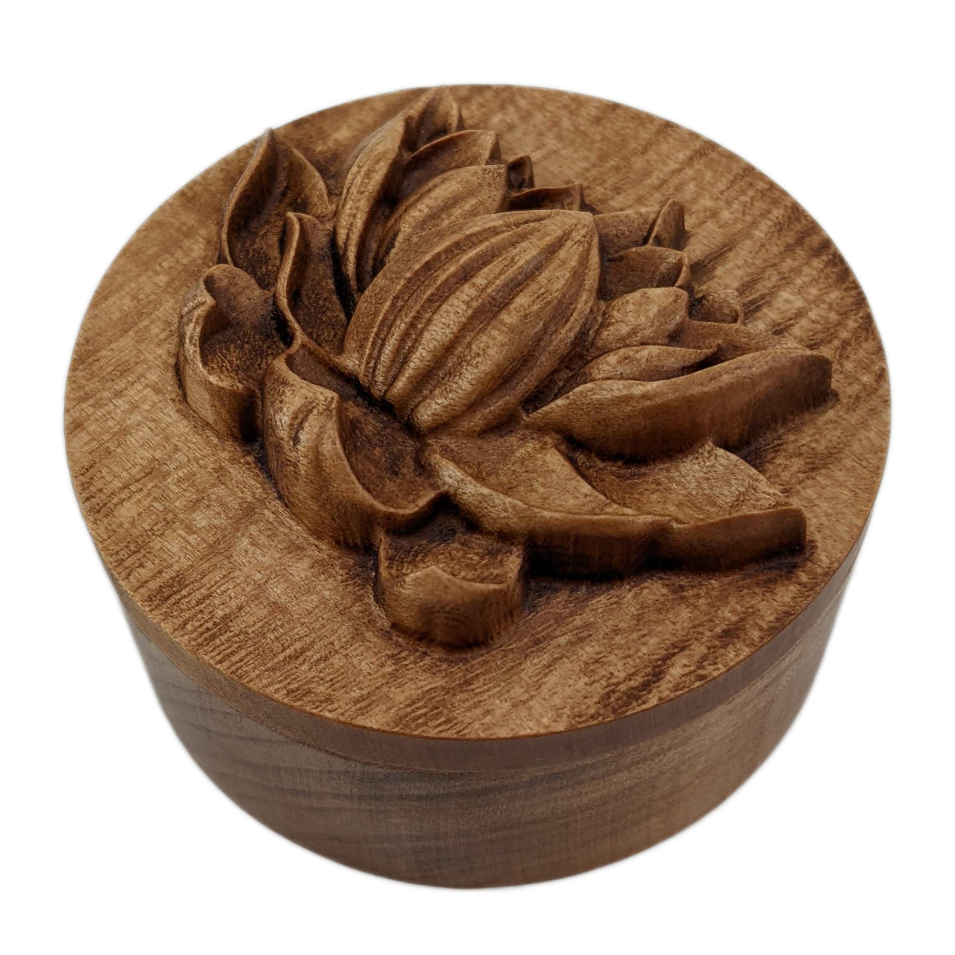 Round wooden box 3D carved with a side profile of a lotus flower. It has several layers of leaves closer to the bottom and layers of petals going up the flower to the pointed center. Made from hard maple wood stained brown against a white background.