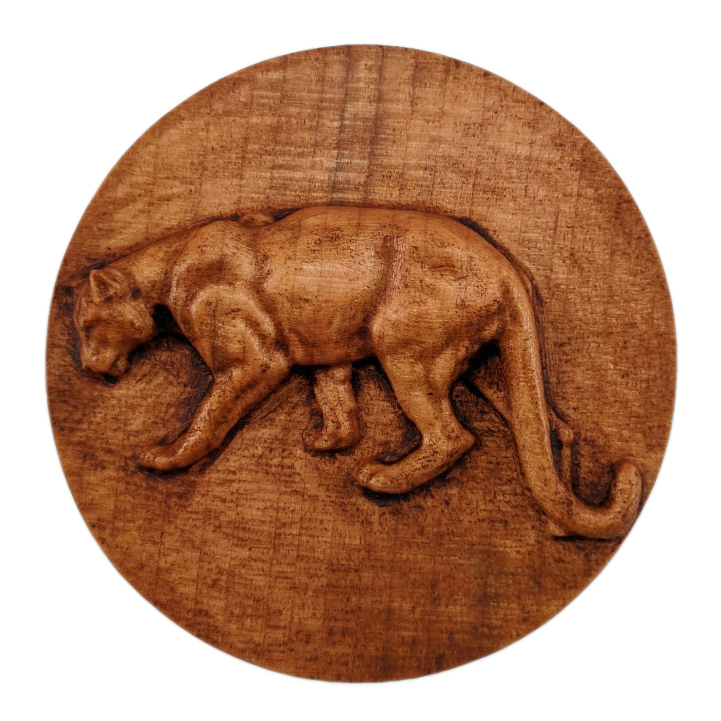 Round wooden box 3D carved with a mountain lion standing broadside to the left. It has a sleek body with its head bent toward the ground and a long tail that hangs to its feet. Made from hard maple wood stained brown against a white background.