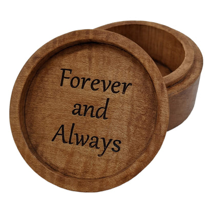 Round wooden box with personalized wording engraved under the lid. Made from hard maple wood, stained brown against a white background.