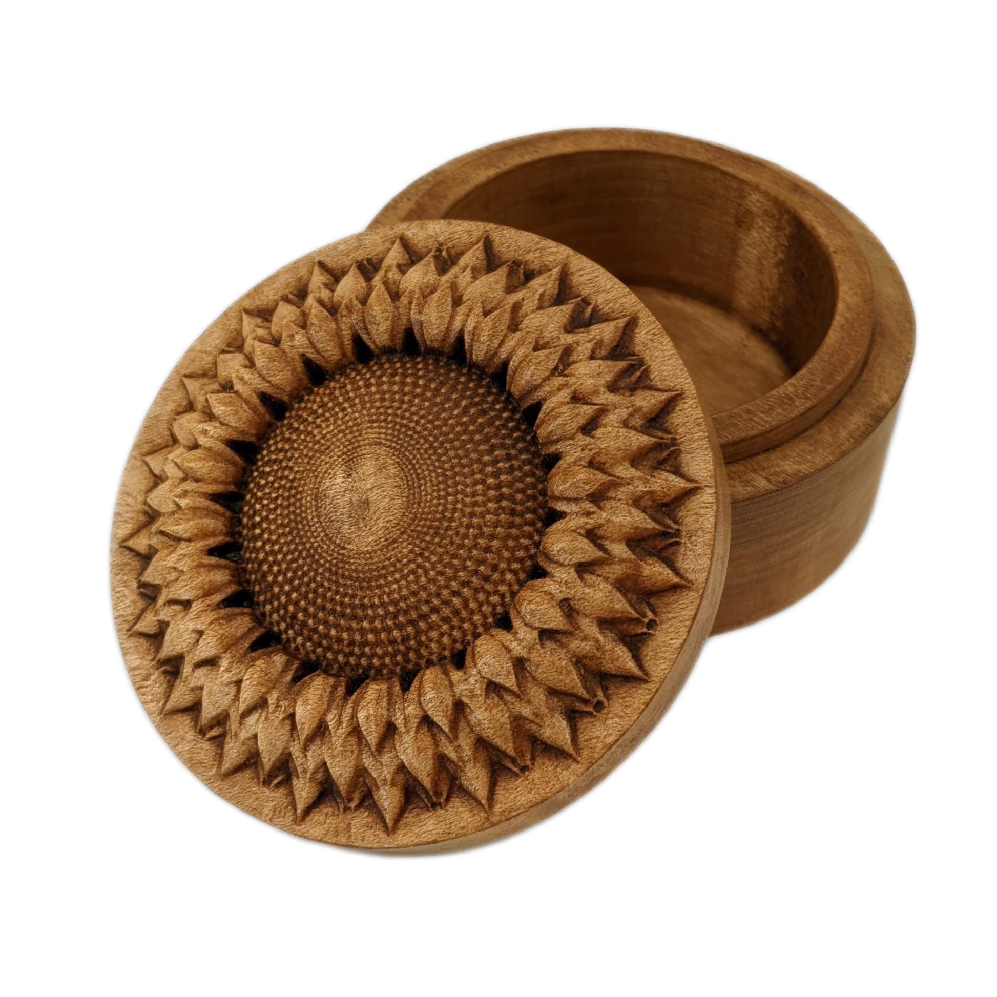 Round wooden box 3D carved with a  top down view of a intricately carved sunflower with dimples covering its center and multiple layered petals circling the center. Made from hard maple wood stained brown against a white background.